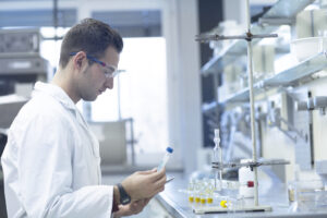 Chemist working in laboratory testing cleaning solvents