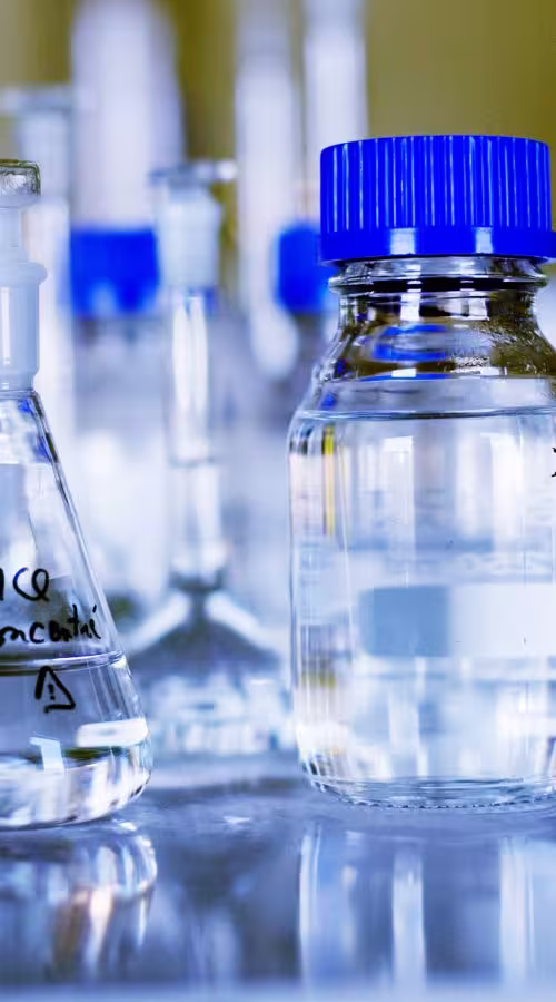 chemicals-in-glass-containers-on-table-at-laborato-2021-08-28-23-55-23-utc-scaled-e1643297121436-pjmwj33fnkccv53vlh0xdislr...